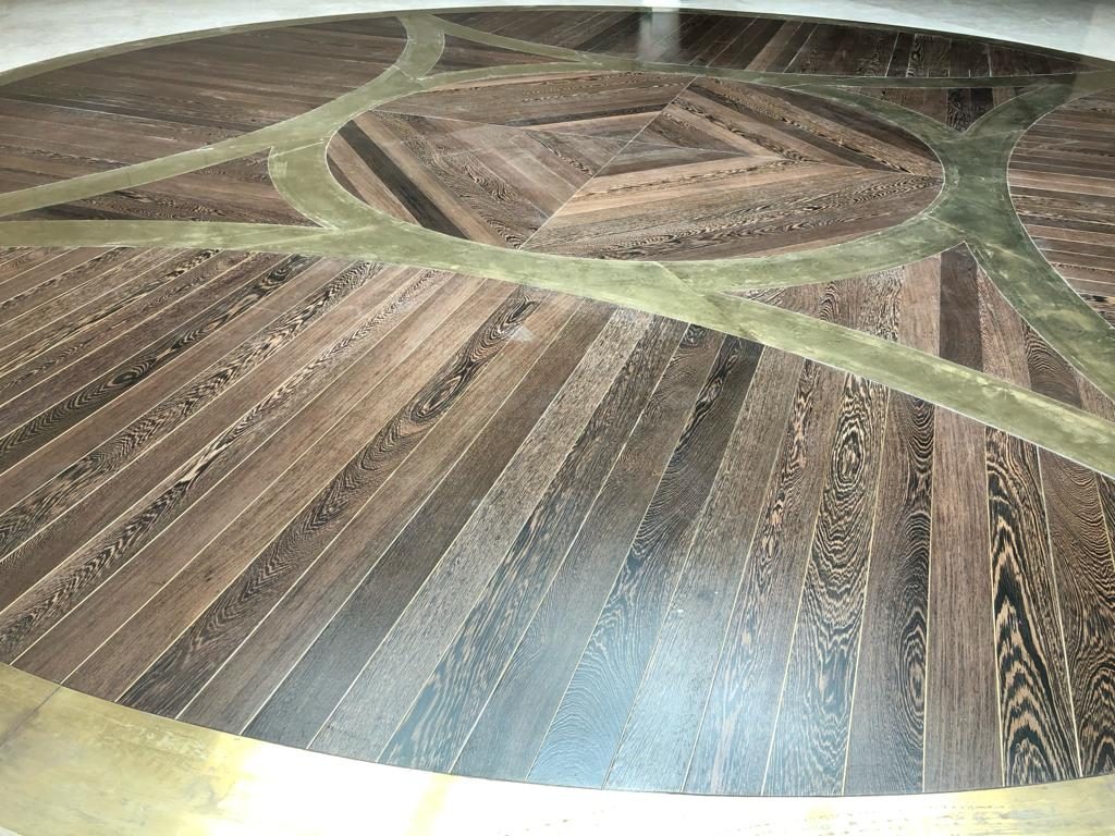 Inlaid parquet floor medallion in stained oak